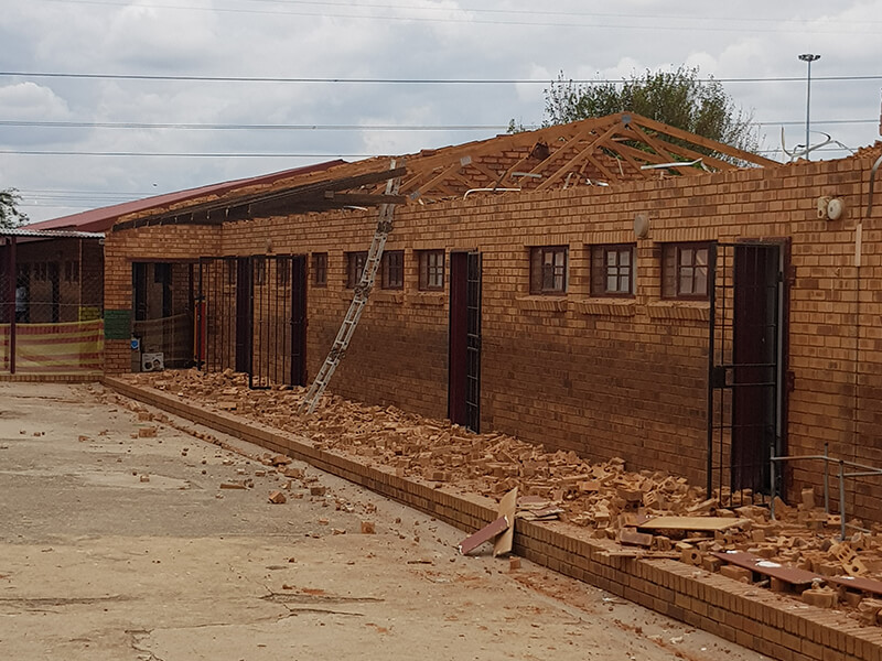 Commercial school roofing contractors installing new roof sheeting in Johannesburg