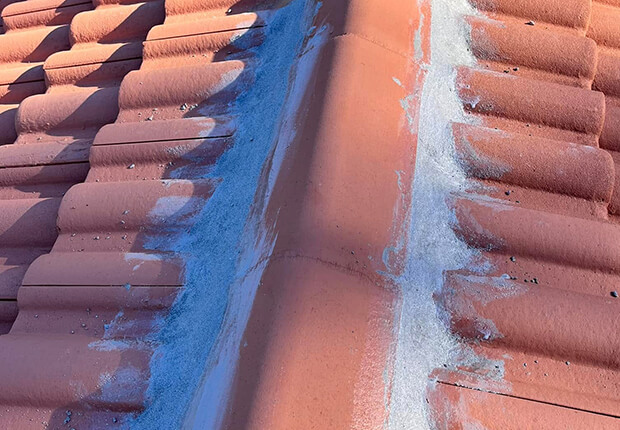 Waterproofing contractors repairing roof leaks and moisture problems