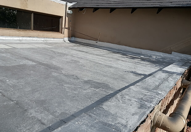 Waterproofing contractors installing torch-on waterproofing system
