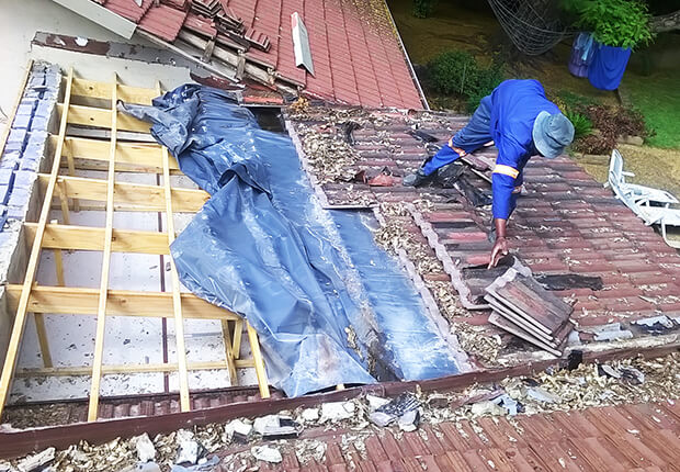 Roof inspection identifying leaks and damaged roofing components