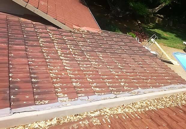 Professional flashing repair work on residential roofing system